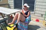 Candy reading on the deck in Kitty Hawk, NC.