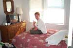 Todd Childs in his bedroom at the beachhouse in Kitty Hawk, NC.